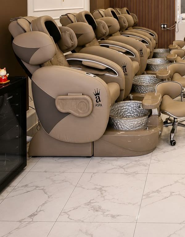 A row of massage pedicure chairs